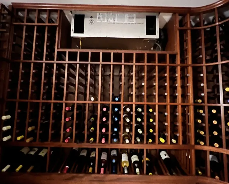 A wine cellar with many bottles of wine.