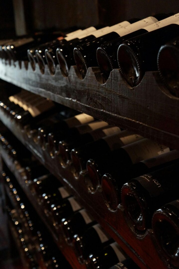 A close up of some bottles on the rack